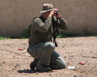 Agent with binoculars
