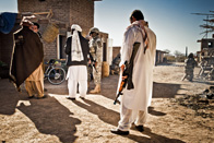 soldiers meeting with Afghan men